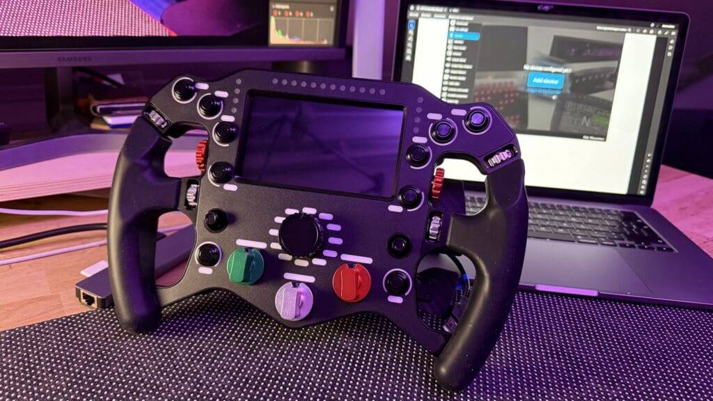 Pokornyi Engineering F499 Review: Build Your Own Ferrari 499 Replica Steering Wheel! 41 a black gaming controller with buttons and buttons